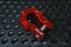 Red aluminum D-shackle set by Mojab on hexagonal metal surface for off-road recovery