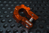 Orange aluminum D-shackle set with MOJAB logo on black textured surface