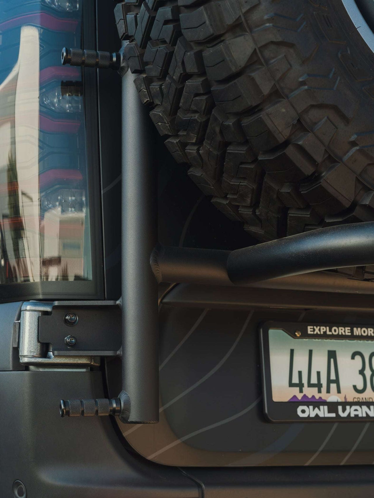 Rear view of Owl ladder and tire carrier on Mercedes Sprinter van