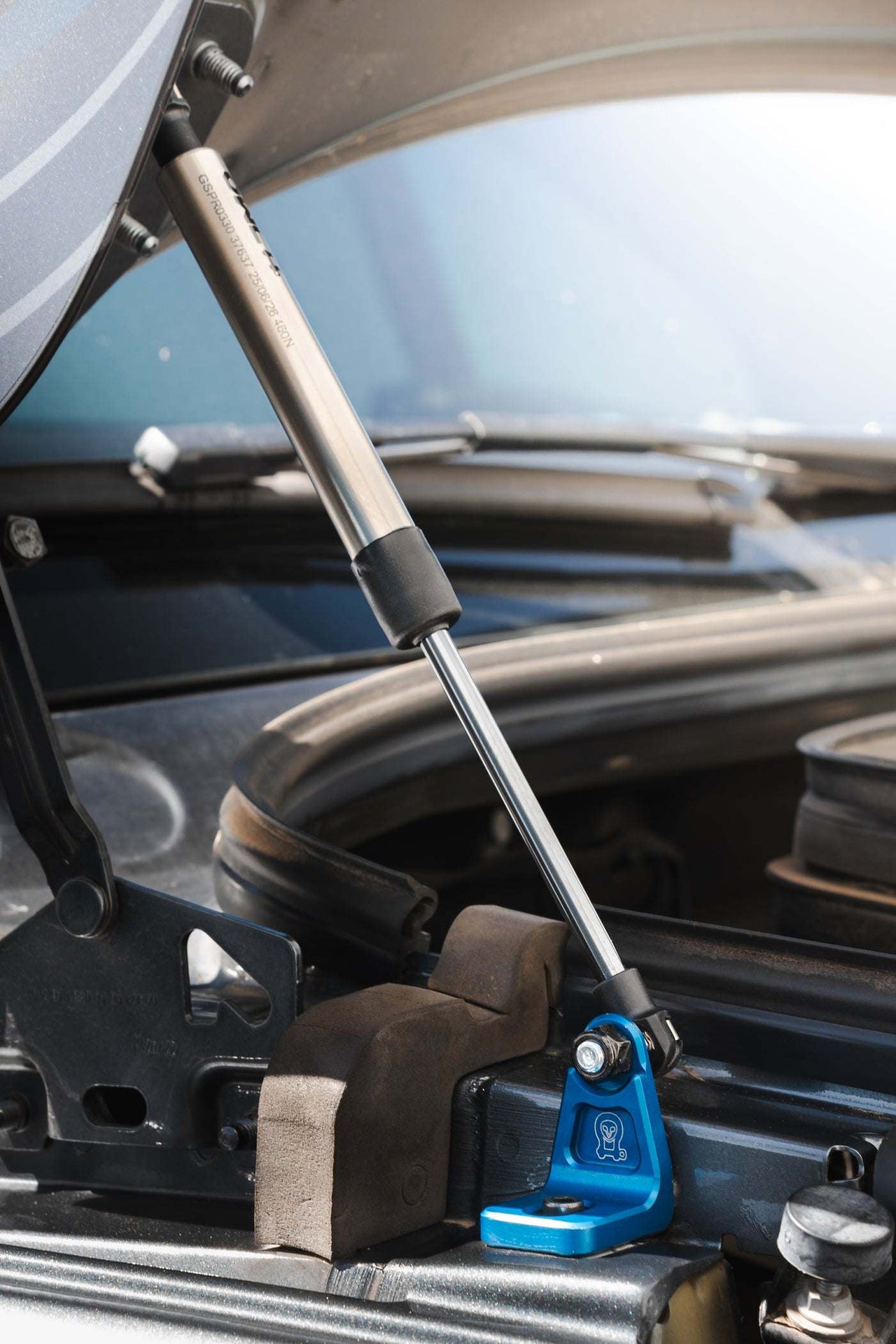 Sprinter Hood Strut Kit with stainless steel gas strut and blue anodized aluminum mount for effortless hood lifting and