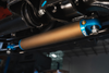 Close-up of Owl Grenadier Steering Stabilizer installed under vehicle chassis for improved street and off-road handling