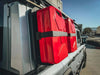 Red 20L jerry cans secured on a gray INEOS Grenadier with Leitner Designs jerry can holder for off-road utility and durability