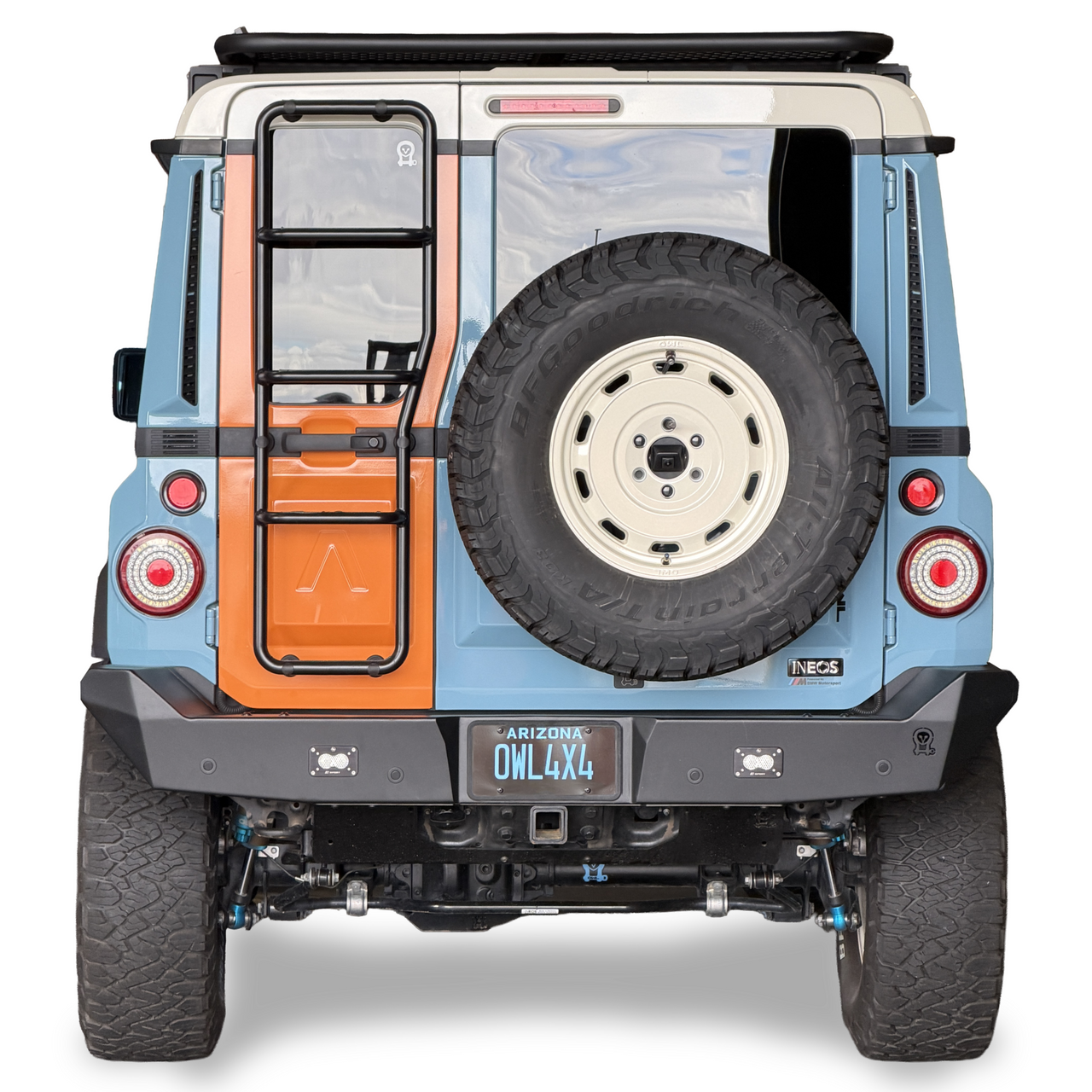 INEOS Grenadier vehicle rear view with high clearance steel rear bumper and spare tire mounted