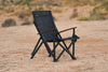 Outer Limits Camp Chair with black diamond-X ripstop sailcloth and black aluminum frame on rocky outdoor terrain