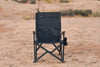 Outer Limits Camp Chair black durable lightweight foldable outdoor seat with aluminum frame and ripstop sailcloth fabric on desert background