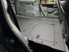 Explore Series second row seat delete plate system installed in vehicle with large access hatches and flat surface