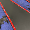 Grenadier Fender Armor Plates with protective adhesive backing on blue surface