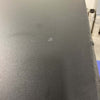Black surface of Owl Monster Box 30 van storage box showing textured finish and minor scratch detail
