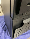 Close-up of black Owl Monster 30 van storage box corner with durable metal construction on blue protective blanket