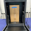 Open box view of black Monster 30 van storage box with open lid and a cardboard box inside