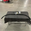 Sprinter Curtain mounting hardware and components laid out on a table with a protective cover in a warehouse setting
