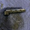 Black Grenadier Hood Release Handle designed for durability and off-road utility placed on a blue quilted protective mat.