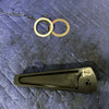 Grenadier Hood Release Handle with metal washers on a blue padded surface