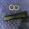 Grenadier Hood Release Handle black lever with two metal washers on blue quilted fabric