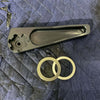 Grenadier Hood Release Handle with mounting rings on a padded surface for off-road vehicle upgrade