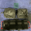 Fieldcraft Survival Modular Visor Panel with two black gear pouches on a blue quilted surface