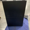 black Van Storage Box Monster 40 with fold-down door on blue protective mat in warehouse