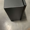 Black metal van storage box with tig-welded seams on concrete floor