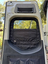 Insulated CLIMA-SHADE Sprinter rear window cover installed on open van door with zippered airflow access