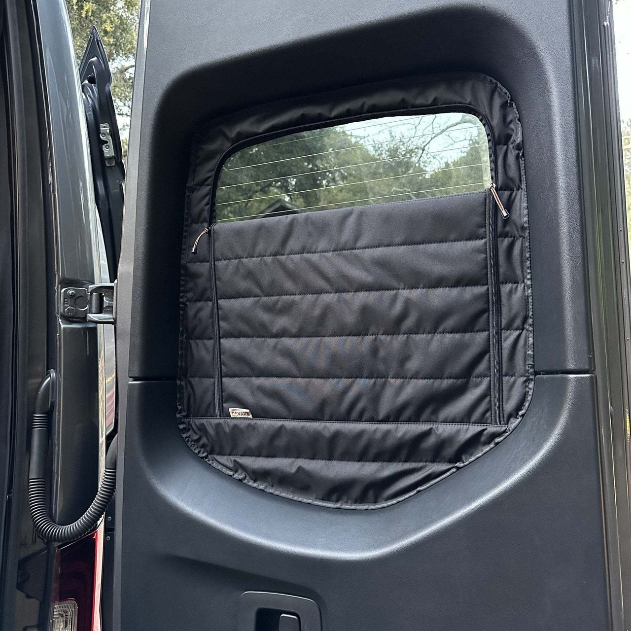 Insulated CLIMA-SHADE Sprinter rear window cover with zippered access for temperature control and privacy