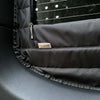 Close-up of black insulated Sprinter rear window cover with zipper for airflow and temperature control