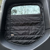 Insulated black CLIMA-SHADE Sprinter rear window cover with zippered airflow access installed on van window