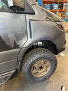 Sprinter van front fender with rugged trail fender flare and off-road tire installed