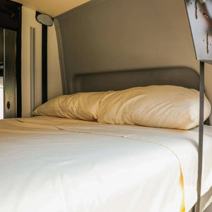 Ultra Luxe Dream Sheets set fitted on Winnebago Revel bed with silky beige microfiber fabric and matching pillowcases