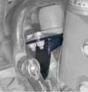 Rally Strut Bump Stop Support Bracket installed on AWD van suspension for enhanced durability and load support