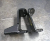 Pair of black metal Rally Strut Bump Stop support brackets for AWD vans placed on concrete floor.