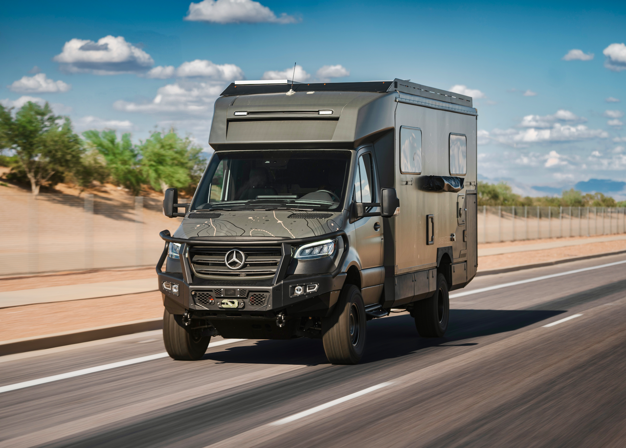 OTX Tiffin Open Trail adventure van on road with rugged design and Mercedes front grille