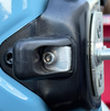 Close-up of rear door washer and rubber bumper mounting on INEOS Grenadier vehicle door.