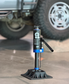 Grenadier SUV truck high performance bottle jack with rugged construction and extended lift height near offroad vehicle tires