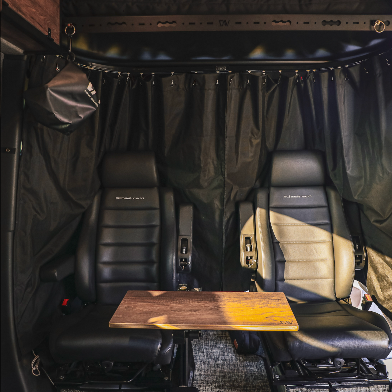 Sprinter Curtain with dual-layer insulation and blackout material installed between van cab and living area for privacy and