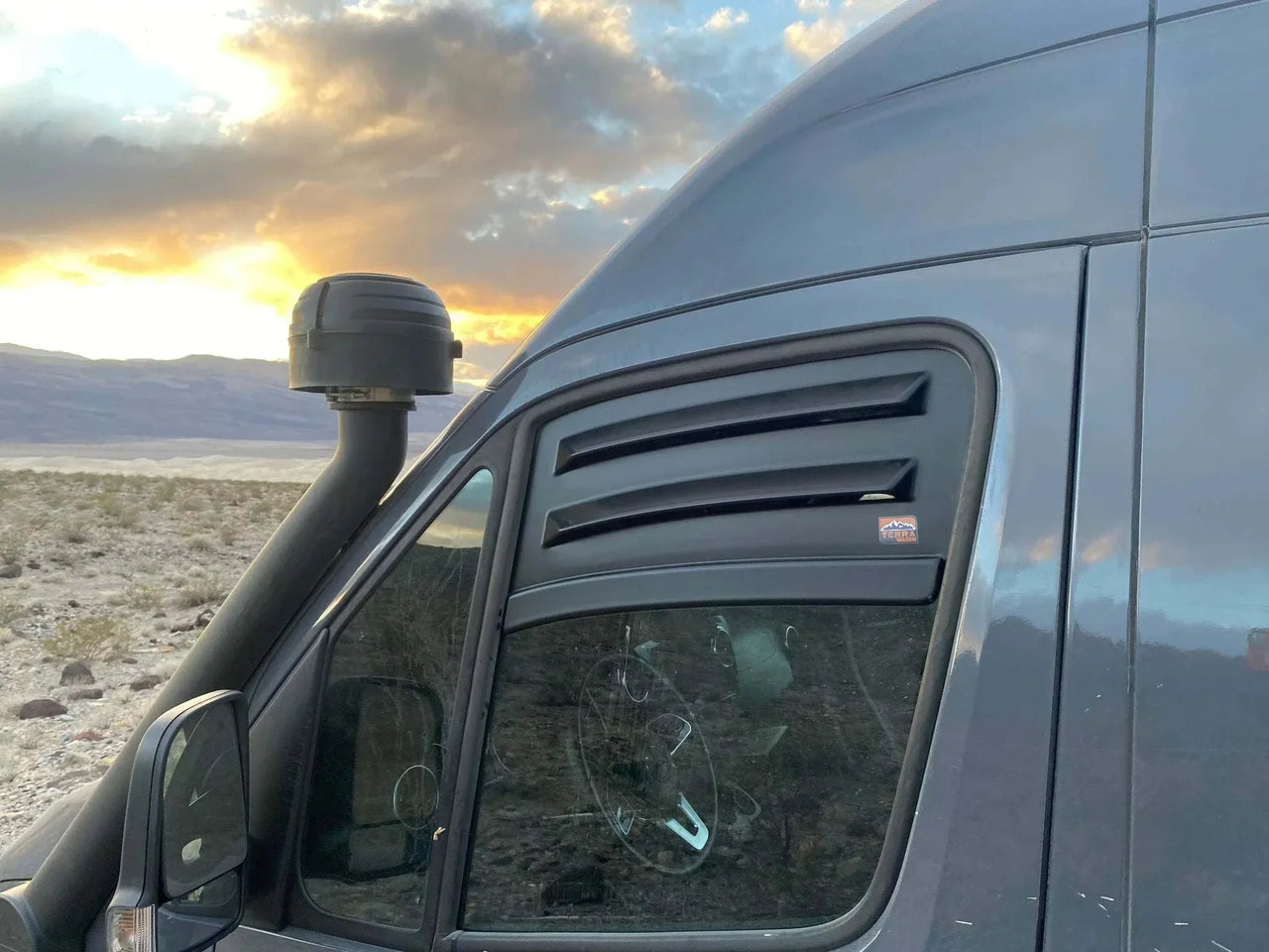 Bug Barrier front window vent installed on Sprinter van for ventilation and bug protection