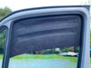 Bug Barrier front window vent installed on Sprinter van door for insect and rain protection with airflow