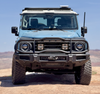 Front view of INEOS Grenadier equipped with a durable Bullbar Roo Bar for off-road protection and utility