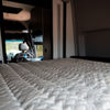 Close-up of ULTRA Luxe Mattress with detailed quilting inside a van interior.