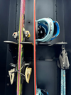 Van storage box with skis, snowboard, and helmet organized inside