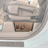 Underseat air compressor system for INEOS Grenadier, mounted under passenger seat for off-road use.