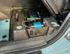 Underseat air compressor system installed in INEOS Grenadier under passenger seat.