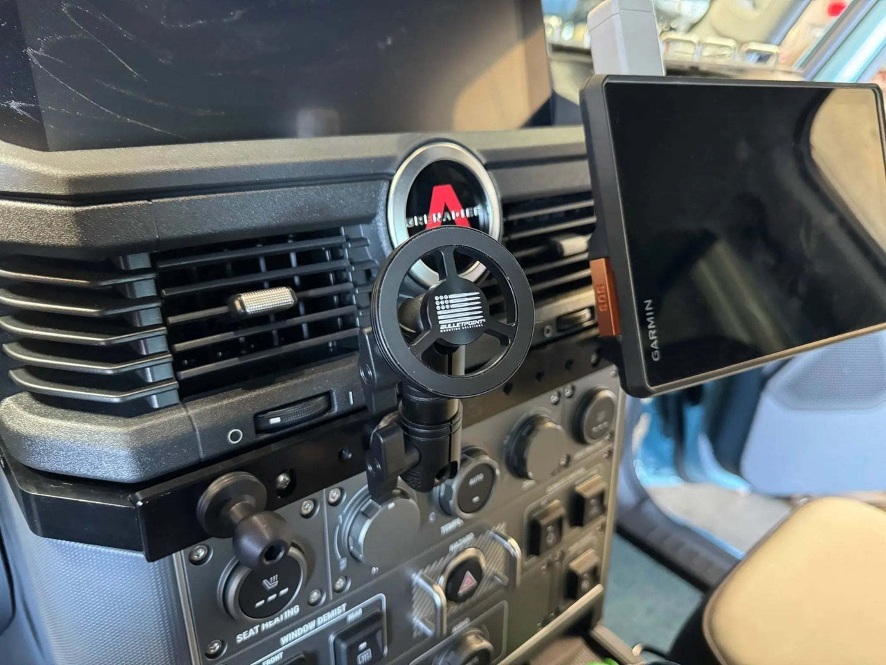 Carbon Fiber/Kevlar Mount Arm installed in vehicle for secure device stability.