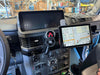 Carbon fiber/Kevlar mount arm in car dashboard securing a GPS device.