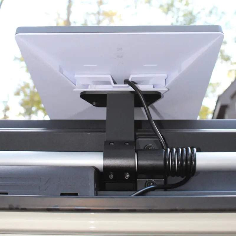 Starlink Mini Power Cable for INEOS Grenadier setup on vehicle roof for off-grid use.