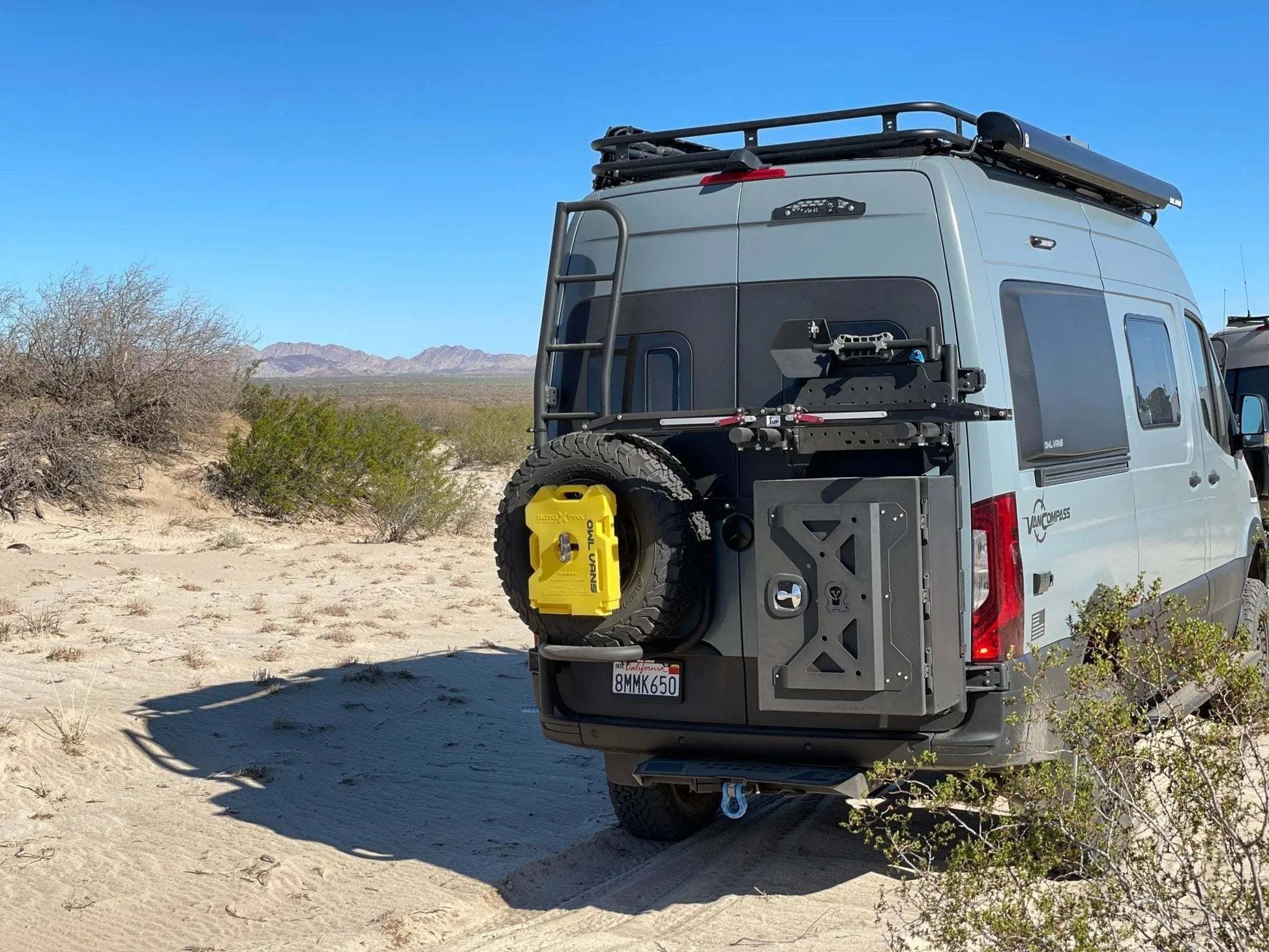 Large Expedition Box mounted on a van in a desert setting.