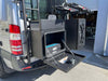 Medium Expedition Cargo Box mounted on rear of off-road vehicle with open doors showing interior storage compartments