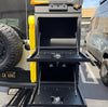 Medium Expedition Cargo Box mounted on vehicle with dual-level open storage compartments, made of durable lightweight aluminum.