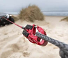 Ultrahook for Winches in use on sandy terrain, red anodized finish.
