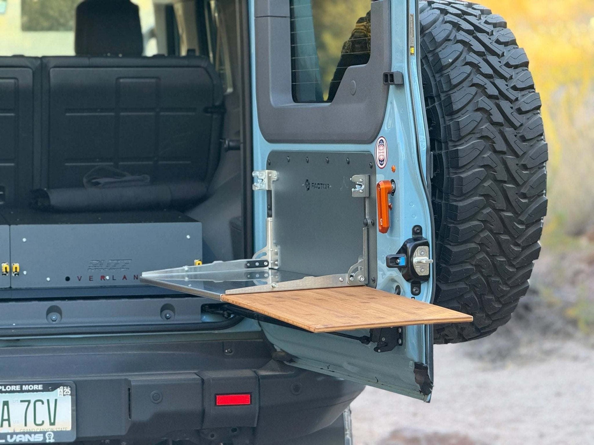 Folding tailgate table for INEOS Grenadier, designed for durability and utility in off-grid adventures.