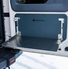 Folding tailgate table installed on INEOS Grenadier for enhanced utility and durability.